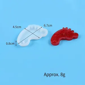 Macro view of baby footprint shaped silicone mold for DIY resin art with dimensions