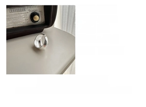 Polished S925 sterling silver curved open ring weighing about 6 grams with a minimalist design