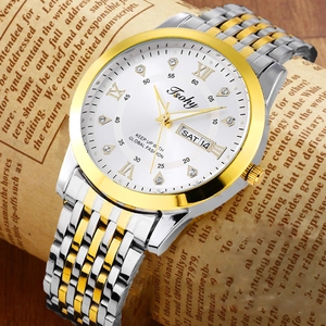 Detailed macro shot of a two-tone quartz watch featuring a crystal-set white Roman dial
