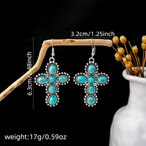 Detail shot of vintage silver cross earrings with turquoise inlay and product dimensions