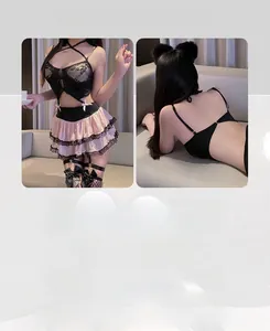 Detailed view of sexy lace lingerie set with pink tiered skirt and black bow details