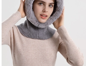 Detail of grey ribbed knit winter hood with plush faux fur trim for cold weather