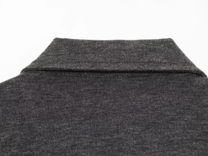 Detail of knitted collar stitching and soft fabric texture on dark grey lounge set