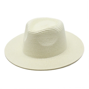 Detail of fine plain weave texture on a cream wide brim straw sun hat for summer