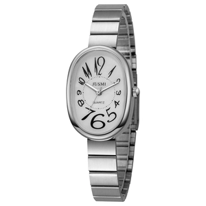 Close-up of vintage silver quartz watch with oval white dial and Arabic numerals