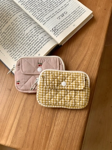 Quilted cotton storage pouches in yellow plaid and pink cherry prints with snap closure