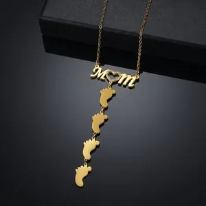 Gold MOM heart necklace with baby feet charms for personalized Mother's Day gifts