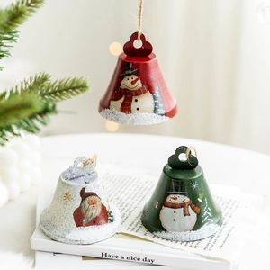 Three festive metal Christmas bells with hand-painted snowman and Santa Claus designs
