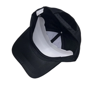 Detail of adjustable snapback closure and washing label on American flag baseball cap