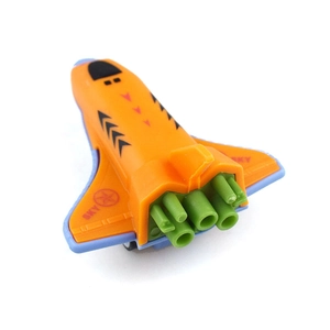 Detail of orange space shuttle toy with green thrusters and SKY star logo for kids