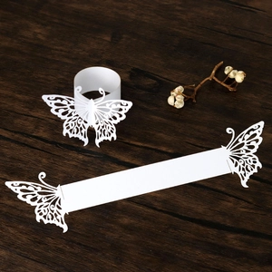 Detailed macro view of laser-cut butterfly paper napkin ring in elegant white finish