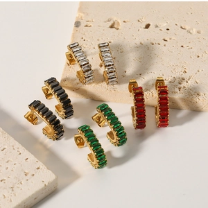 Detail of 18K gold stainless steel hoop earrings with white, black, green and red square zircons