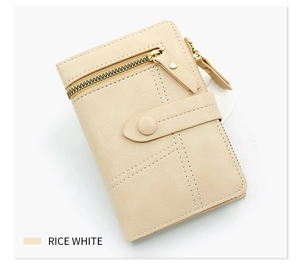 Detailed macro view of rice white PU leather wallet texture with metal zipper and snap closure