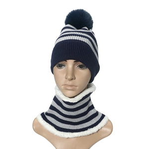 Navy blue striped knitted beanie and scarf set with faux fur pom pom and warm fleece lining