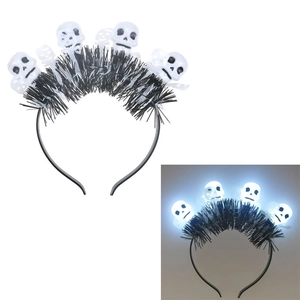 Detail of Halloween LED headband featuring white skulls and black tinsel with glowing effect