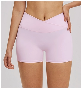 Detailed close-up of V-shaped crossover waistband on high-stretch yoga shorts