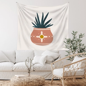 Detail of bohemian tapestry featuring geometric sun terracotta pot and green plant pattern