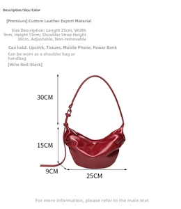Macro shot of burgundy crescent shoulder bag with size specs 25x9x15cm and leather texture