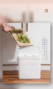 Detail showing the strong sealing lid and narrow design of the white kitchen trash can