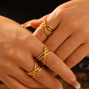 French style 18k gold plated titanium steel ring with hollow cross-line wrap design