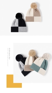 Detailed knit texture and fluffy faux fur pom-pom on chic color-block winter beanies