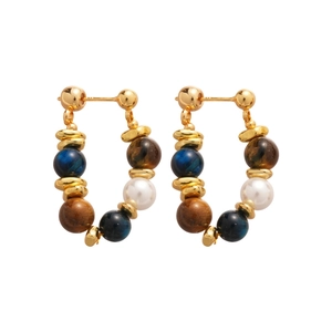 Tiger eye and pearl beaded earrings with golden metal accents on a clean white background
