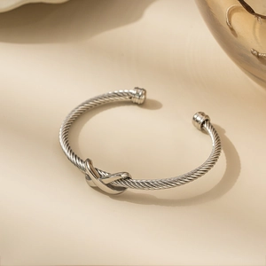 Silver twisted wire stainless steel cuff bracelet with crossover X design and spherical ends