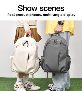 Detailed view of minimalist school backpacks in beige and dark gray with side pockets