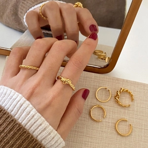 Minimalist 925 sterling silver triple knot ring with 18K gold plating on model