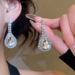 Elegant silver teardrop earrings with crystals and pavé rhinestones for luxury look