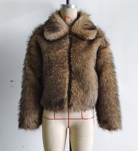 Detail of faux fur jacket with large lapel and dark metal zipper closure