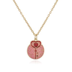 Golden necklace featuring a pink enamel butterfly donut pendant with a red heart key design