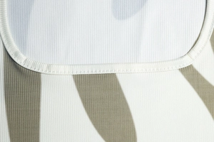 Macro view of ribbed knit fabric texture with abstract zebra print on sleeveless dress