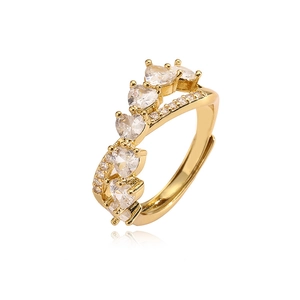 Macro detail of V-shaped adjustable ring with heart-shaped zircon stones and gold plating