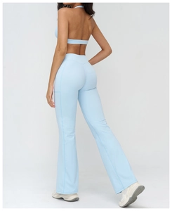 Detail of light blue flared yoga pants with side pockets and racerback sports bra set