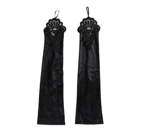 Detail of long black satin fingerless gloves with floral lace and beadwork for brides