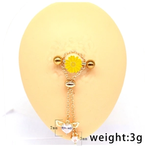 Detail view of 7mm heart zircon and yellow daisy pendant on gold body jewelry piece