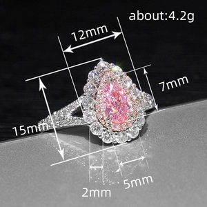 Luxurious multi-layer silver ring with pear-cut pink crystal and halo diamond accents