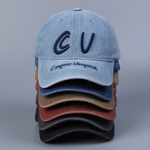 Detailed embroidery on peak and crown of various colored washed denim baseball caps
