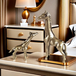Golden giraffe figurines set with metallic texture on bedside table for home decor