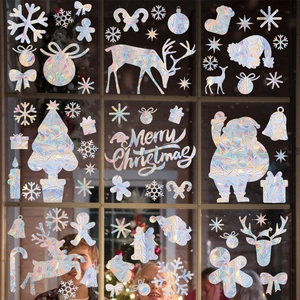 Rainbow laser Christmas window clings showing reindeer and snowflake decals on glass
