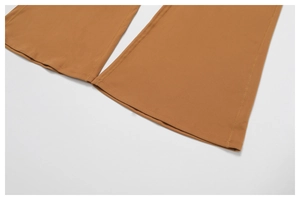 Close-up of caramel flare yoga pants featuring durable four-needle six-thread stitching