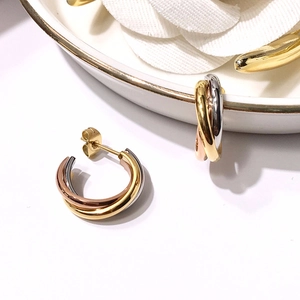 Minimalist tri-color triple interlocking hoop earrings in gold, silver, and rose gold finishes