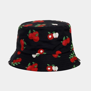 Close-up of the fine stitching and cotton texture on a black fruit pattern bucket hat