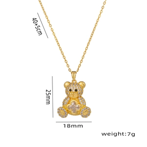 Golden teddy bear pendant necklace with crystal clover and dimensions 25x18mm