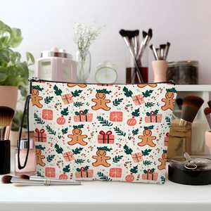 Christmas gingerbread man printed toiletry bag with zipper and handle on a vanity desk