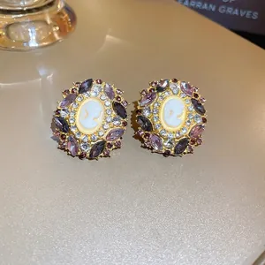 French vintage cameo earrings with purple crystals and gold plated portrait design