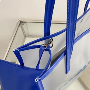 Blue and white tote bag with clear view of the premium black metal hook hardware closure