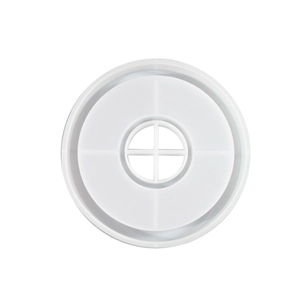Macro detail of a round translucent silicone mold featuring a unique cross-shaped center slot