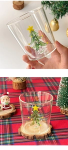 Detailed view of heat-resistant glass cup with a green Christmas tree inner design